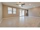 Bright living room with tile floors and sliding glass door at 841 Riverlawn Pl, Las Vegas, NV 89138