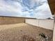 Enclosed backyard with gravel landscaping and tall privacy fences at 8834 Duncan Barrel Ave # 103, Las Vegas, NV 89178