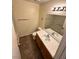 Bathroom featuring double sinks, a large mirror, and a shower-tub combo at 8834 Duncan Barrel Ave # 103, Las Vegas, NV 89178