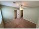 Neutral bedroom featuring a ceiling fan, carpet, and closet for ample storage space at 8834 Duncan Barrel Ave # 103, Las Vegas, NV 89178