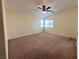 Large bedroom with natural light and ceiling fan at 8834 Duncan Barrel Ave # 103, Las Vegas, NV 89178