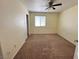 Well-lit bedroom with carpet, closet, and a ceiling fan at 8834 Duncan Barrel Ave # 103, Las Vegas, NV 89178