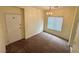 Bright dining area featuring a modern chandelier and natural light at 8834 Duncan Barrel Ave # 103, Las Vegas, NV 89178