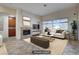 Virtually staged living room with tile floors and a fireplace at 9632 Cherry Canyon Ave, Las Vegas, NV 89129