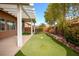 Relaxing backyard with covered patio and putting green at 9644 Padre Peak Ct, Las Vegas, NV 89178