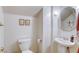 Small powder room with pedestal sink and toilet at 10016 Diving Duck Ave, Las Vegas, NV 89117