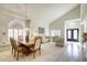 Elegant dining room features a wood table and chairs, and a view of the living room at 10016 Diving Duck Ave, Las Vegas, NV 89117