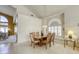 Bright dining area with a wood table and chairs near a window at 10016 Diving Duck Ave, Las Vegas, NV 89117