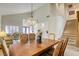 Dining room with a large table, lighting fixture, and access to the living room at 10016 Diving Duck Ave, Las Vegas, NV 89117