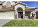 Two story house with a double door entry and landscaped lawn at 10016 Diving Duck Ave, Las Vegas, NV 89117