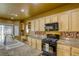 Kitchen boasts granite counters and ample cabinetry at 10016 Diving Duck Ave, Las Vegas, NV 89117