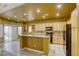 Open kitchen with breakfast bar and access to backyard at 10016 Diving Duck Ave, Las Vegas, NV 89117