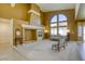 Living room with a fireplace and large window at 10016 Diving Duck Ave, Las Vegas, NV 89117