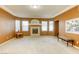 Bright living room featuring a fireplace and large windows at 10016 Diving Duck Ave, Las Vegas, NV 89117