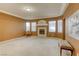 Bright living room featuring a fireplace and large windows at 10016 Diving Duck Ave, Las Vegas, NV 89117