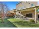 View of backyard, covered patio, and grill at 10166 Bishops Peak Ct, Las Vegas, NV 89141