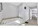 Spacious bathroom with a corner bathtub and access to bedroom at 10166 Bishops Peak Ct, Las Vegas, NV 89141