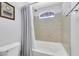 Clean bathroom with tub shower combo and gray walls at 10166 Bishops Peak Ct, Las Vegas, NV 89141