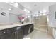 Elegant bathroom with double vanity, large shower, and soaking tub at 10166 Bishops Peak Ct, Las Vegas, NV 89141