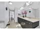 Bright bathroom with double vanity and view of bedroom at 10166 Bishops Peak Ct, Las Vegas, NV 89141