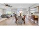 Open concept dining room with hardwood floors and adjacent living space at 10166 Bishops Peak Ct, Las Vegas, NV 89141