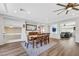 Elegant dining room with hardwood floors and views to the living room and kitchen at 10166 Bishops Peak Ct, Las Vegas, NV 89141