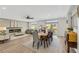 Open concept dining room with hardwood floors and views to the living room and kitchen at 10166 Bishops Peak Ct, Las Vegas, NV 89141