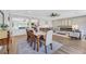 Open concept dining area with a view of the living room and kitchen at 10166 Bishops Peak Ct, Las Vegas, NV 89141