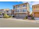 Two-story house with a three-car garage and landscaped front yard at 10166 Bishops Peak Ct, Las Vegas, NV 89141