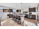 Modern kitchen with dark cabinetry, granite island, and stainless steel appliances at 10166 Bishops Peak Ct, Las Vegas, NV 89141