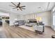 Living room features a fireplace, hardwood floors, and comfortable seating at 10166 Bishops Peak Ct, Las Vegas, NV 89141