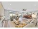 Bright living room with hardwood floors, fireplace, and ample seating at 10166 Bishops Peak Ct, Las Vegas, NV 89141