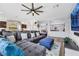 Spacious living room featuring a sectional sofa, ottoman, and large TV at 10166 Bishops Peak Ct, Las Vegas, NV 89141