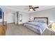 Spacious main bedroom with ceiling fan, large bed and en-suite bathroom at 10166 Bishops Peak Ct, Las Vegas, NV 89141