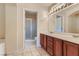 Double vanity bathroom with large mirror and shower at 10489 Bolting Cloud Dr, Las Vegas, NV 89178