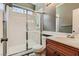 Bathroom with shower, toilet and wooden vanity at 10489 Bolting Cloud Dr, Las Vegas, NV 89178