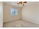 Bright bedroom with ceiling fan and window coverings at 10489 Bolting Cloud Dr, Las Vegas, NV 89178