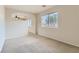 Bedroom with window, ceiling fan and neutral decor at 10489 Bolting Cloud Dr, Las Vegas, NV 89178