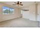 Bright bedroom with large window and ceiling fan at 10489 Bolting Cloud Dr, Las Vegas, NV 89178