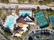 Community pool, tennis courts, and clubhouse viewed from above at 11280 Granite Ridge Dr # 1032, Las Vegas, NV 89135