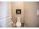 Small powder room with toilet and art above at 11280 Granite Ridge Dr # 1032, Las Vegas, NV 89135