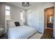 Bedroom with striped bedding and ensuite bathroom at 11280 Granite Ridge Dr # 1032, Las Vegas, NV 89135