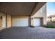 Two-car garage with overhead doors and ample parking space at 11280 Granite Ridge Dr # 1032, Las Vegas, NV 89135