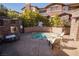 Relaxing hot tub area with lounge chairs and outdoor fireplace at 11280 Granite Ridge Dr # 1032, Las Vegas, NV 89135