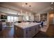 Modern kitchen island with white quartz countertop and gray cabinetry at 11280 Granite Ridge Dr # 1032, Las Vegas, NV 89135