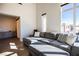 Spacious living room with sectional sofa and abundant natural light at 11280 Granite Ridge Dr # 1032, Las Vegas, NV 89135