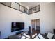 Open living space with large TV and view of upper level loft at 11280 Granite Ridge Dr # 1032, Las Vegas, NV 89135