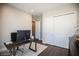 Home office with a desk, large closet, and hardwood floors at 11280 Granite Ridge Dr # 1032, Las Vegas, NV 89135