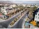 Aerial view of community entrance with palm trees and modern homes at 11327 Gravitation Dr, Las Vegas, NV 89135