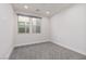 Spacious bedroom with grey carpet and two windows at 11327 Gravitation Dr, Las Vegas, NV 89135